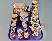 A tray containing 11 assorted character jugs including Beswick Sairey Gamp,