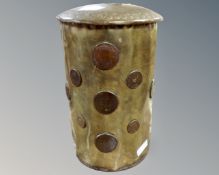 An antique Danish brass tankard with inset coins.