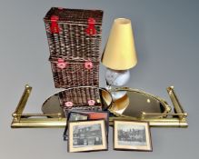 A brass extending fire curb together with two wicker baskets containing assorted pictures and