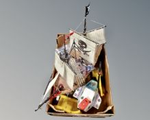 A box containing Playmobil including pirate galleon and crew, spaceship, helicopter,