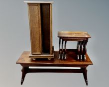 A nest of three oak tables together with a refectory coffee table and a revolving media stand.