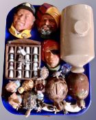 A tray containing slipware hot water bottle, Bossons wall plaque, china thimbles on stand,