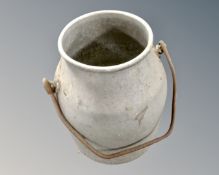A vintage aluminium cast iron handled milk churn.