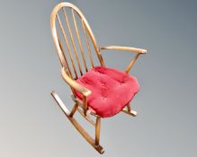 An Ercol elm and beech rocking chair in an antique finish.