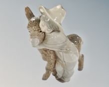 A Lladro figure, Platero and Marcelino (boy hugging donkey), no. 1181.