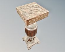 A carved oak plant stand (height 60cm)