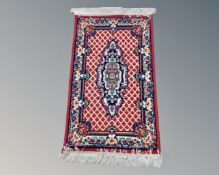 A small eastern woollen rug,