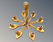 A Continental oak eight branch light fitting.