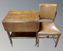 A 20th century flap sided two tier tea trolley fitted with a drawer, together with a dining chair.