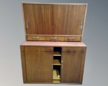 A 20th century Scandinavian teak shutter door cabinet (width 103cm),