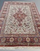 A Heriz-style carpet, probably Indian, on red and cream ground,