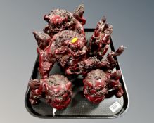 A tray containing six Chinese resin figures.
