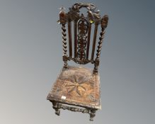 A 19th century carved oak barley twist hall chair together with a cutlery canteen on barley twist