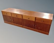 A pair of late 20th century Danish double door low cupboards fitted with two drawers.