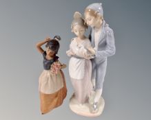 A Nao figure group of a boy and girl in Spanish dress holding a dove,
