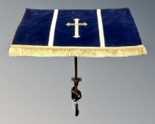 A church lectern on adjustable metal pole.