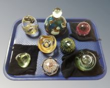 A tray of eight glass paperweights to include Mdina,