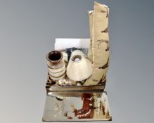 A box containing West German pottery vase, draft excluders, unframed mirrors.