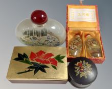 A tray containing reverse painted glass scent bottles and lacquered boxes.