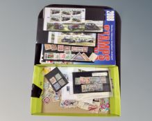 A tray containing Stanley Gibbons stamp album together with assorted world stamps.