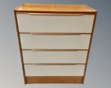 A 20th century teak five drawer chest together with a similar four drawer chest.