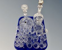 A tray containing Edinburgh Crystal ship's style decanter with stopper, two further decanters,