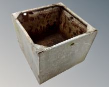 Two galvanized metal water tanks.