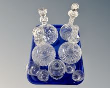 A tray containing four crystal decanters with stoppers, further decanter, glasses etc.