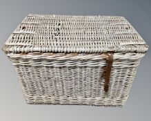 A vintage painted wicker hamper.