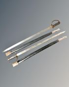 Two reproduction sabres in sheaths.