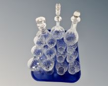 A tray containing three crystal decanters with stoppers,