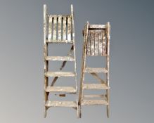 Two sets of vintage folding steps.