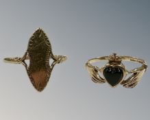 A 9ct yellow gold Claddagh ring, size K, 1.6g, together with a 9ct yellow gold size N½, 1.4g.