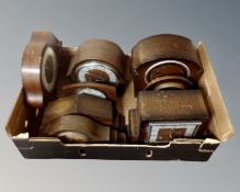 A box of 20th century oak mantel clocks.