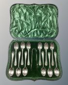 A set of twelve cased silver teaspoons with tongs,