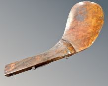 A vintage wooden boat rudder,