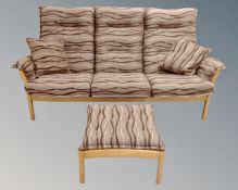 An Ercol high back wood framed four piece lounge suite with cushions,