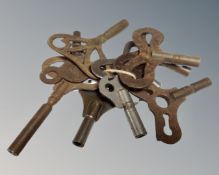 Nine early 20th century steel clock keys including Popular Progress etc.