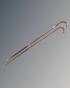 Two antique walking sticks, one with silver mounts.