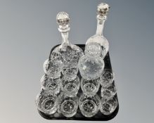 A tray containing three lead crystal decanters, a set of eight glasses etc.
