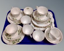 A collection of 22 pieces of Tuscan Bridal Flower tea china.