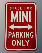 A reproduction metal parking sign.
