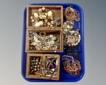 Two Eastern carved trinket boxes together with a collection of costume jewellery.