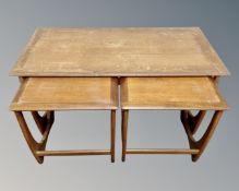 A nest of three mid-20th century teak G Plan tables.