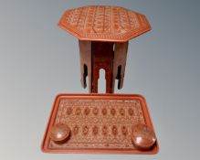 An Eastern lacquered octagonal folding table,