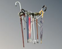 A quantity of umbrellas and walking sticks.