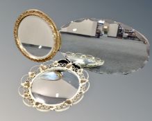 A circular gilt framed bevel edged mirror together with a wrought iron framed convex mirror and a