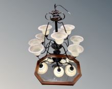 An impressive Hinkley wrought metal nine branch chandelier with glass shades together with a mirror