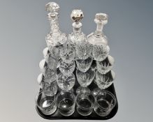 A tray containing three lead crystal decanters with stoppers,