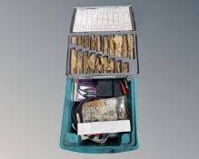 A box containing drill bit set, spark plug analyzers etc.